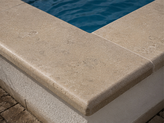 Porto Beige Limestone coping in European-style outdoor pool design