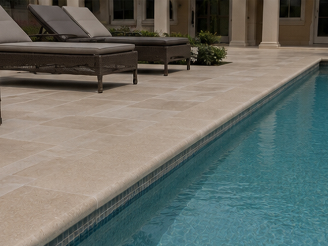 Porto Beige Limestone Pool Coping in classical European-style pool setting