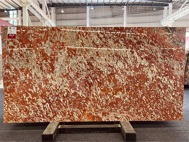 Languedoc Marble large format feature wall with dramatic red natural stone