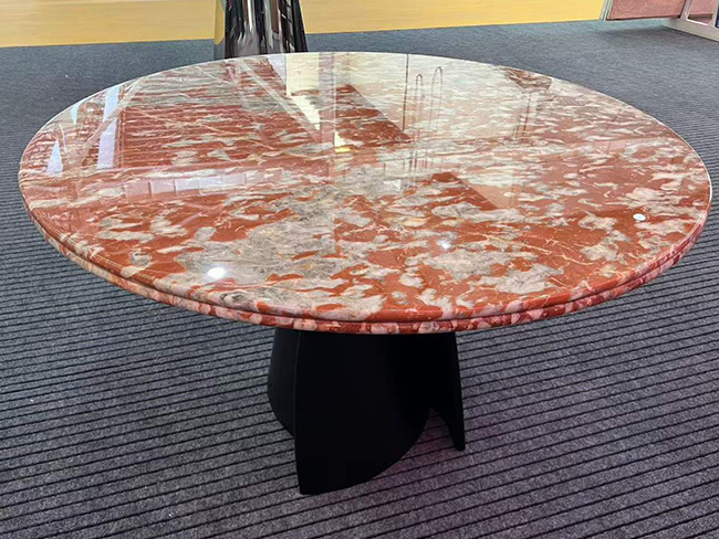 Languedoc Marble round dining table with red and white natural veining